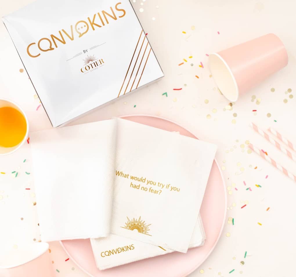 a flat lay of convokins branding, a plate, a plastic cup and a written question and the colours are gold, pink and white - 11 Fun Things To Do On This Labor Day Weekend
