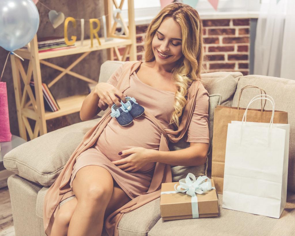 pregnant woman smiling down - drive-by baby shower