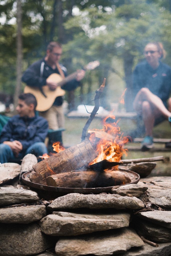 campfire with people in the background