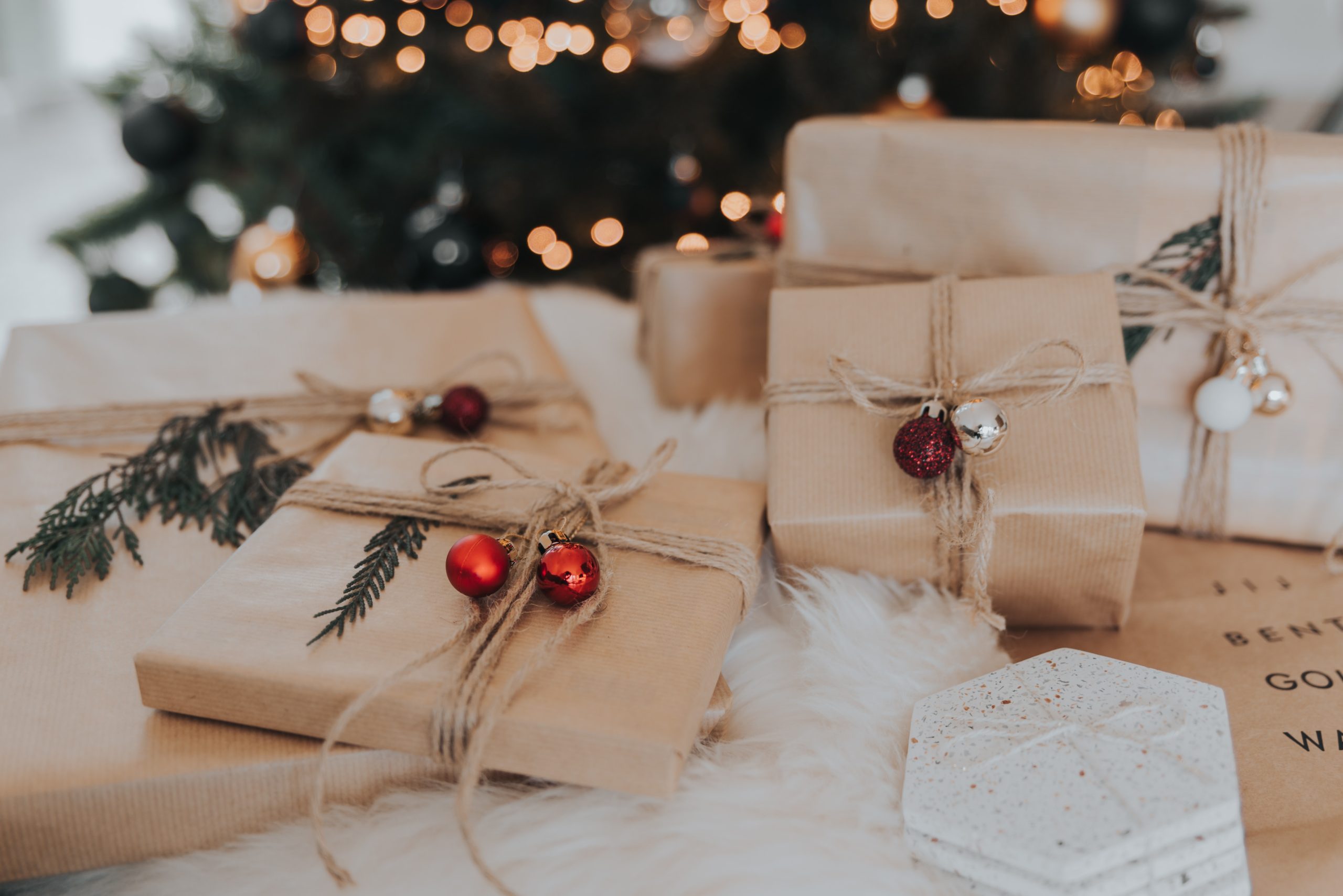 pile of christmas gifts under a tree