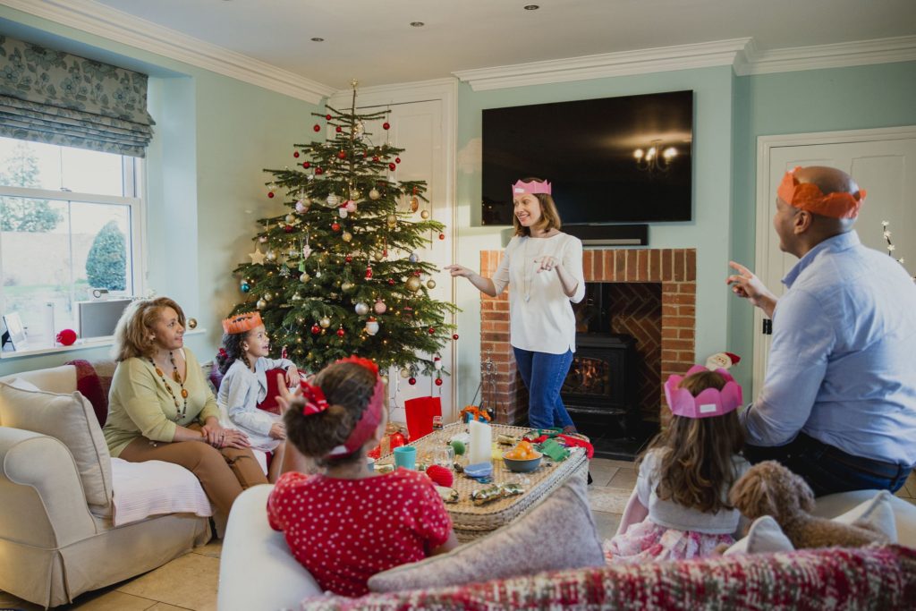 a group of people playing a christmas game