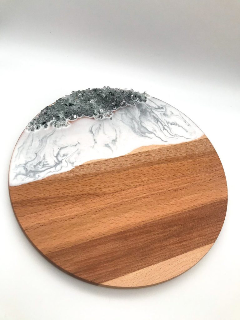 a marble and wooden cheeseboard