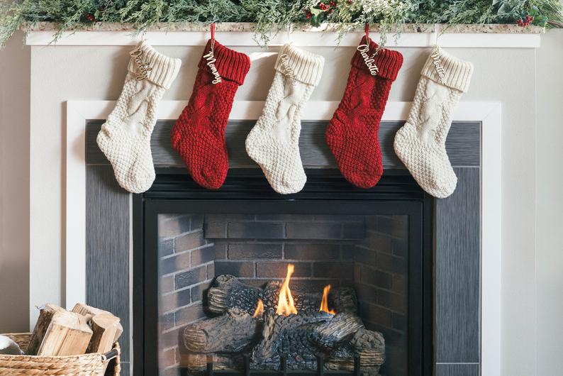 red and white stockings on a fireplace