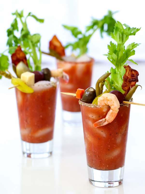 bloody mary cocktails with shrimp and olives