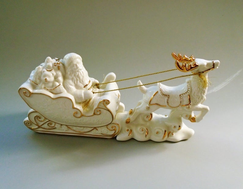 white and gold santa sleigh