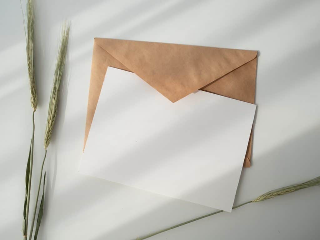 flat lay of a plain envelope and letter 