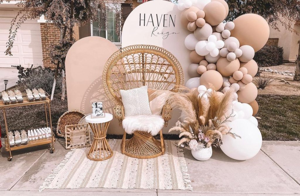 drive-by baby shower boho setting with rattan chair