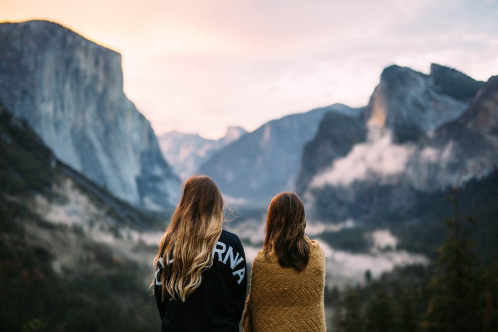 two girls looking out to the mountains