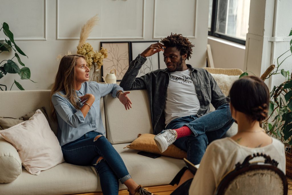 people talking on a couch together