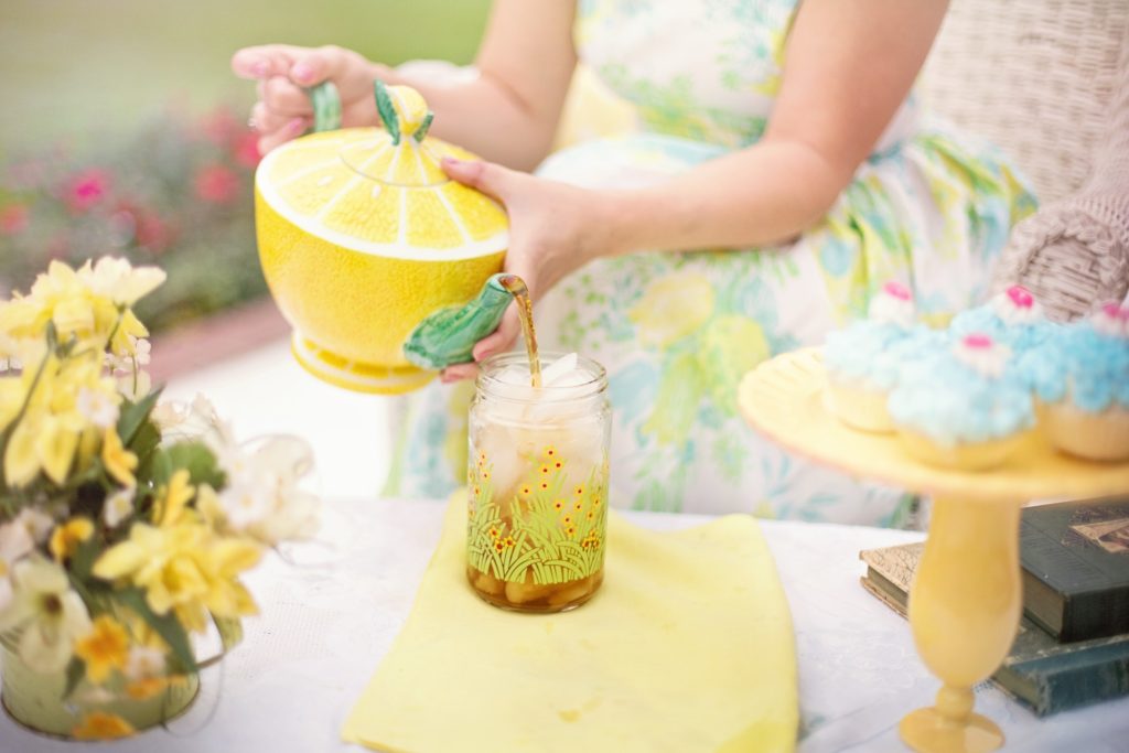 lady pouring a glass of tea