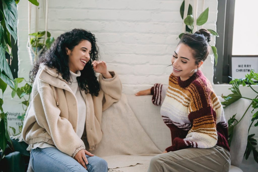 two people talking on a couch meaningful conversation starters