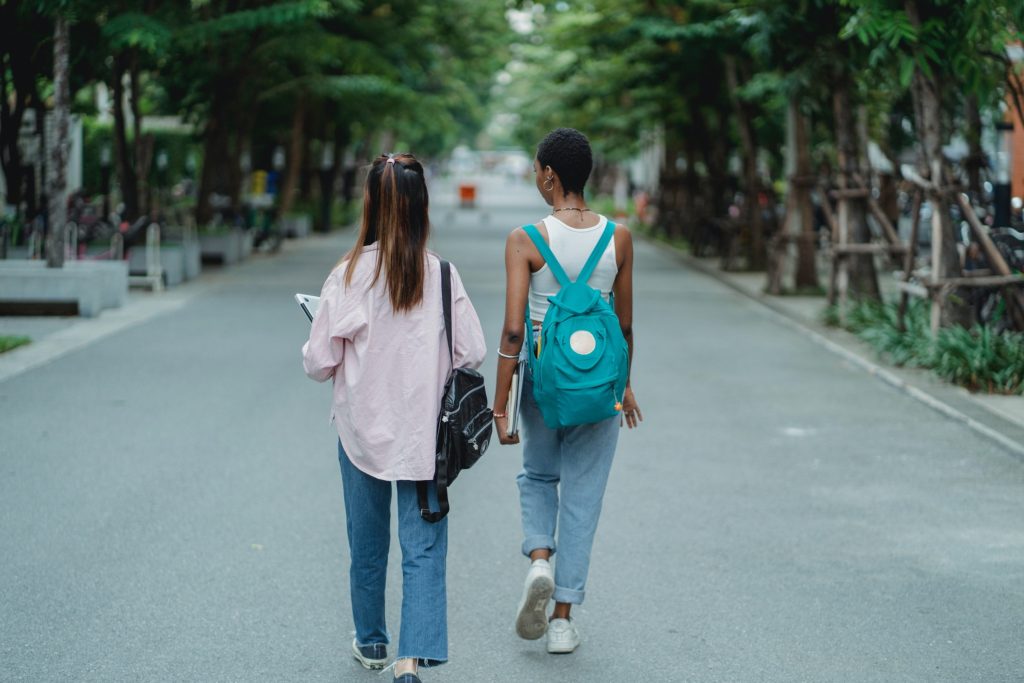 two people walking through a park together meaningful conversation starters