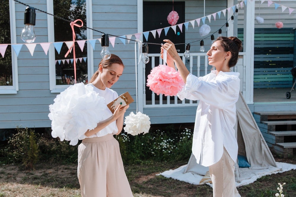 friends helping set up a bridal shower