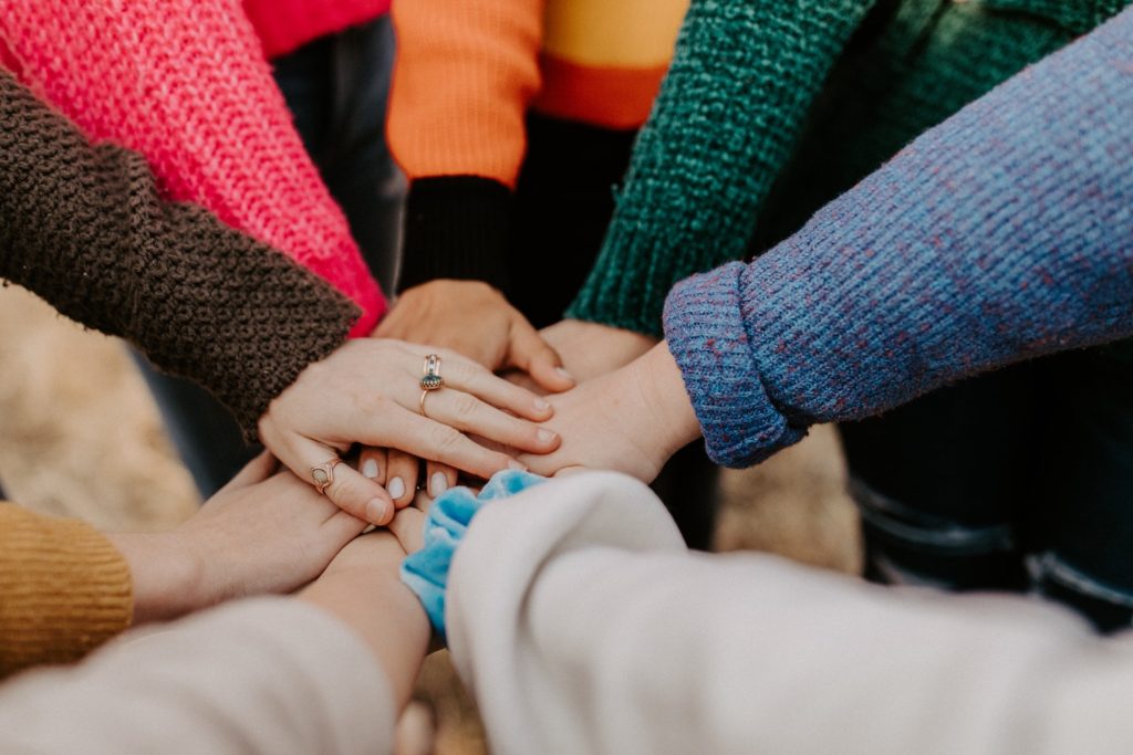 hands of people together