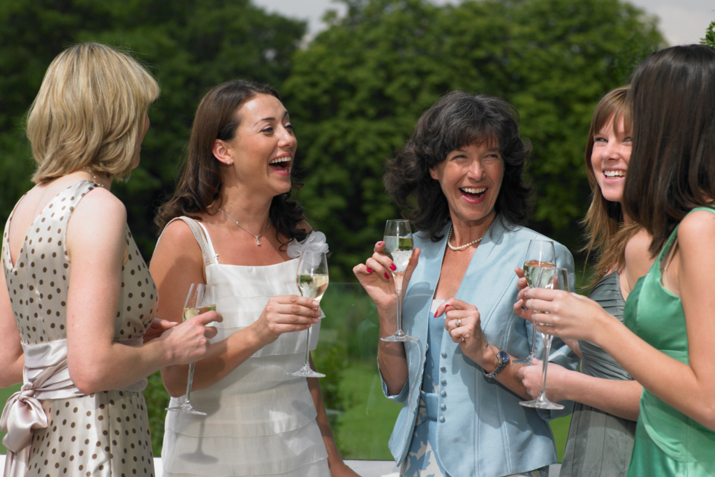 guests at a wedding talking and laughing