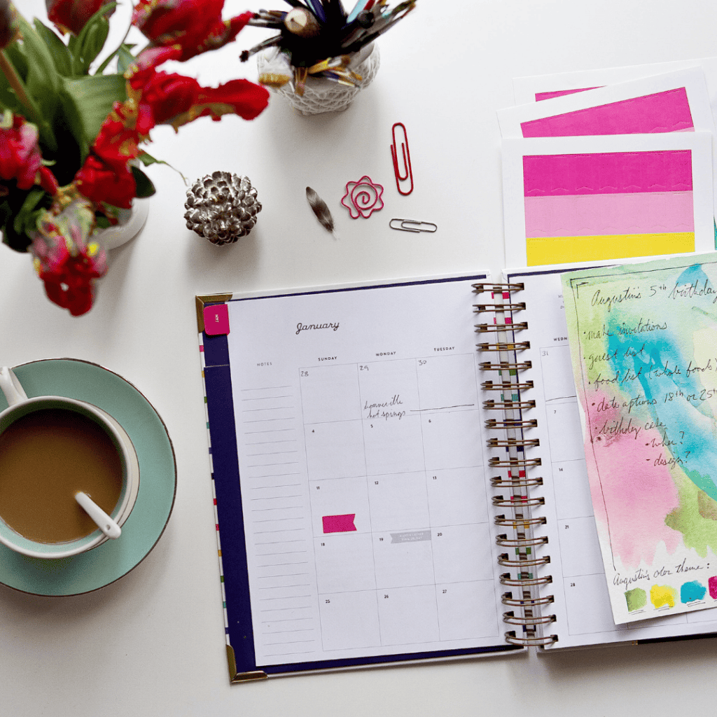 planner being used to help plan for a galentine's day party