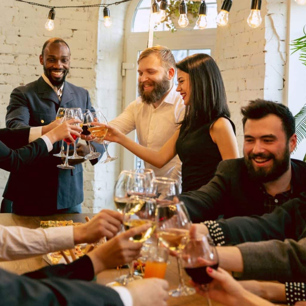 fun hostess at a party cheersing guests